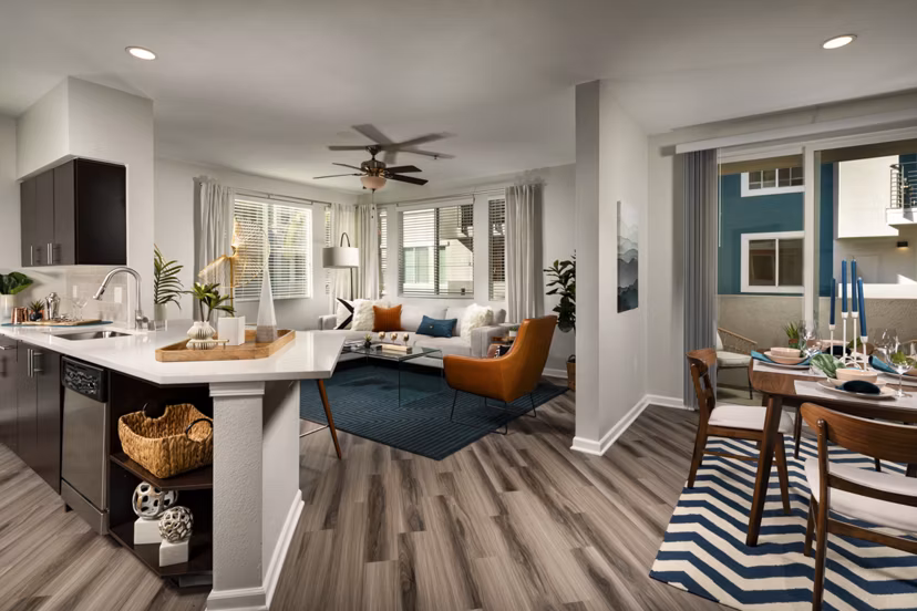 Modern kitchen with stainless steel appliances at The District Apartments