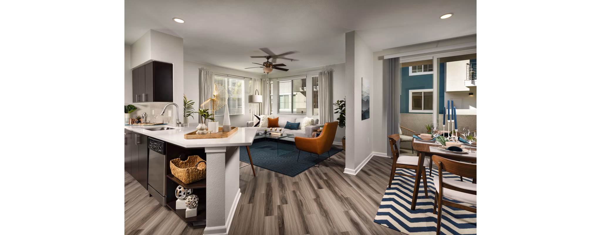 Modern kitchen with stainless steel appliances at The District Apartments