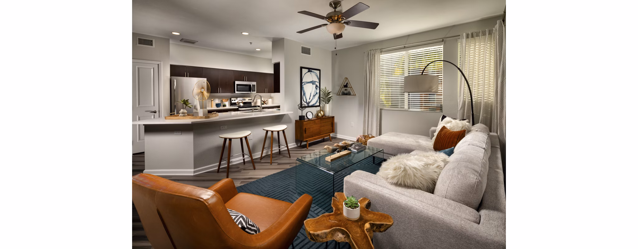 Spacious living room with modern decor at The District Apartments