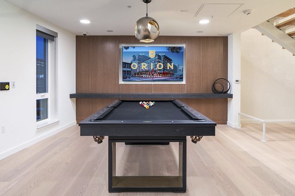 clubhouse game room at Orion Apartments