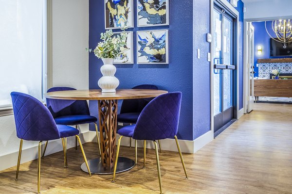 The Village at Tierra Antigua: Elegant clubhouse lobby with modern decor and comfortable seating in a luxury apartment community