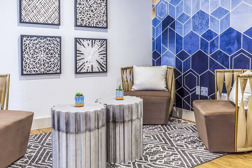 Spacious clubhouse lobby with elegant decor at The Village at Tierra Antigua Apartments, ideal for socializing and relaxing in a luxury setting