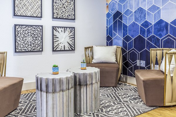Spacious clubhouse lobby with elegant decor at The Village at Tierra Antigua Apartments, ideal for socializing and relaxing in a luxury setting