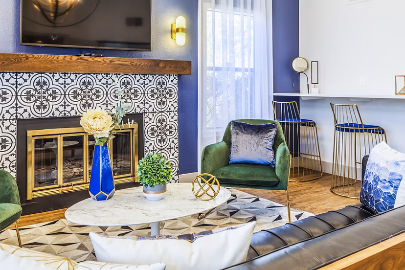 Clubhouse lobby with elegant seating and modern decor at The Village at Tierra Antigua Apartments