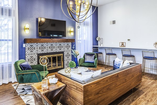 Clubhouse lobby featuring modern furnishings and open layout at The Village at Tierra Antigua Apartments