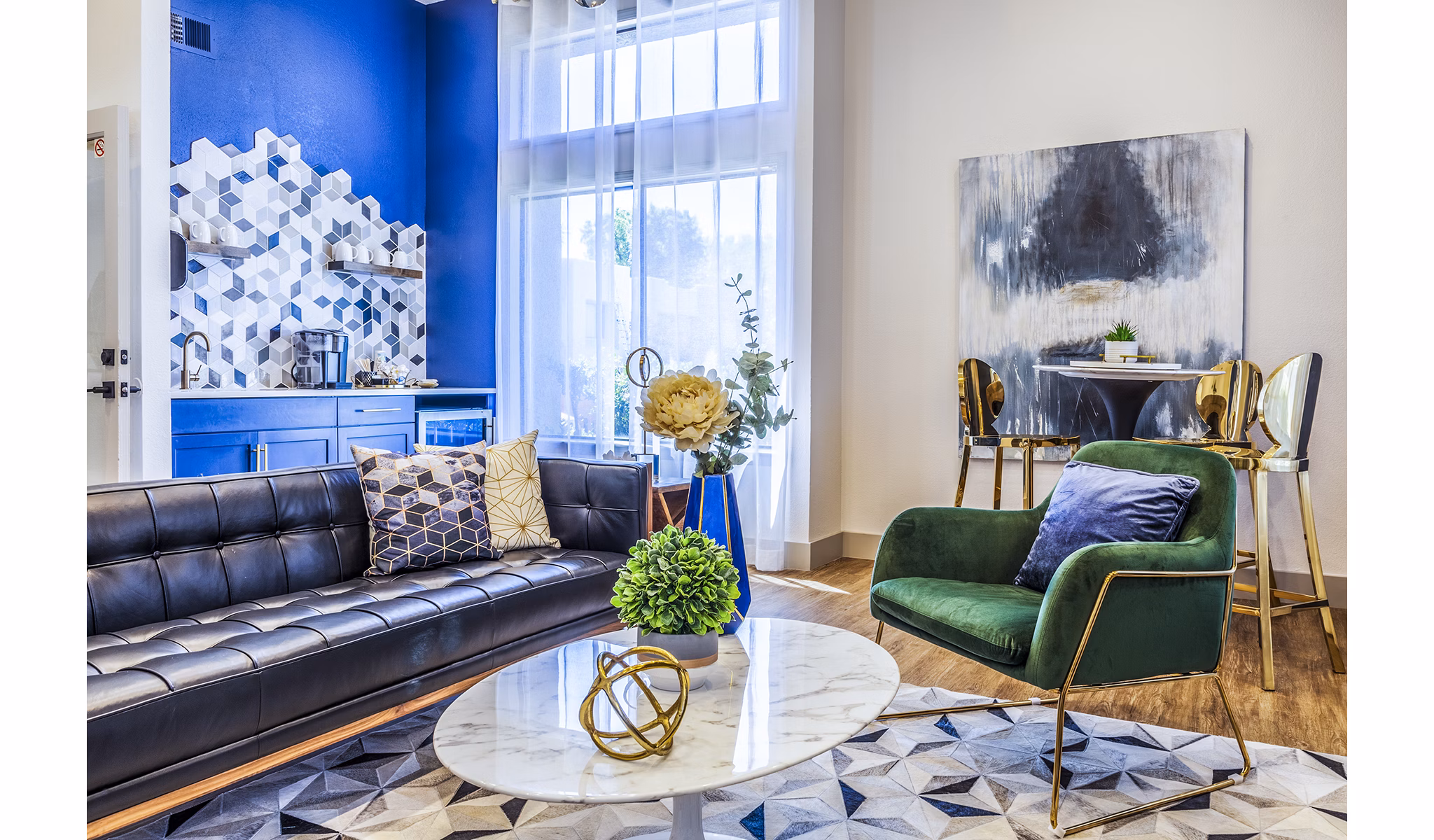 Clubhouse lobby with modern seating and open layout at The Village at Tierra Antigua Apartments