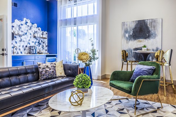 Clubhouse lobby with modern seating and open layout at The Village at Tierra Antigua Apartments