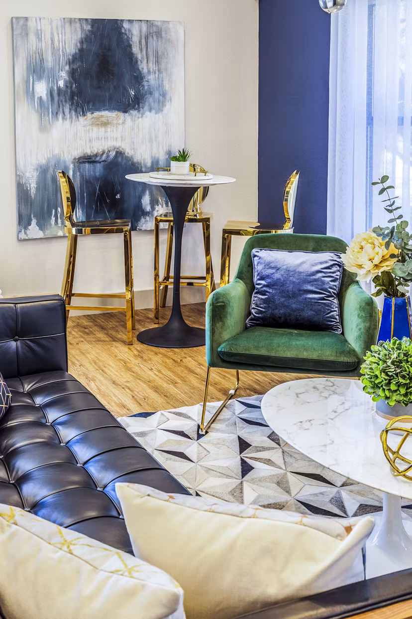 Clubhouse lobby with modern seating and stylish decor at The Village at Tierra Antigua Apartments