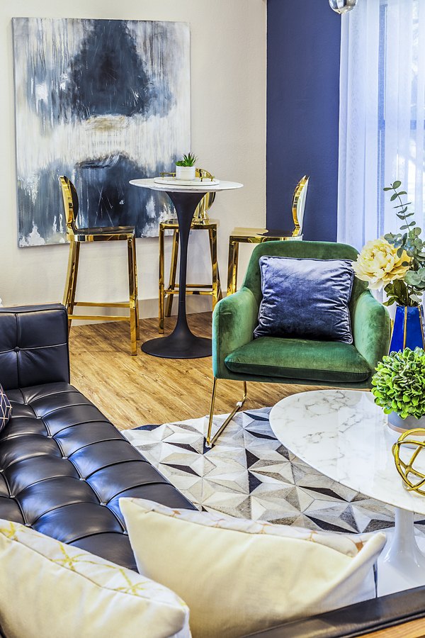 Clubhouse lobby with modern seating and stylish decor at The Village at Tierra Antigua Apartments
