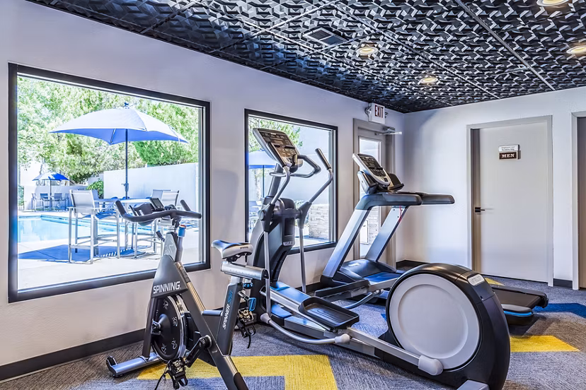 State-of-the-art fitness center featuring modern equipment at The Village at Tierra Antigua Apartments
