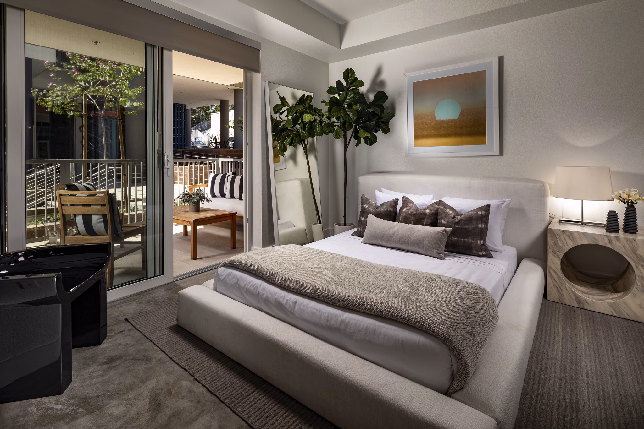 Modern bedroom with stylish decor at LA Plaza Village Apartments