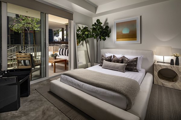 Modern bedroom with stylish decor at LA Plaza Village Apartments