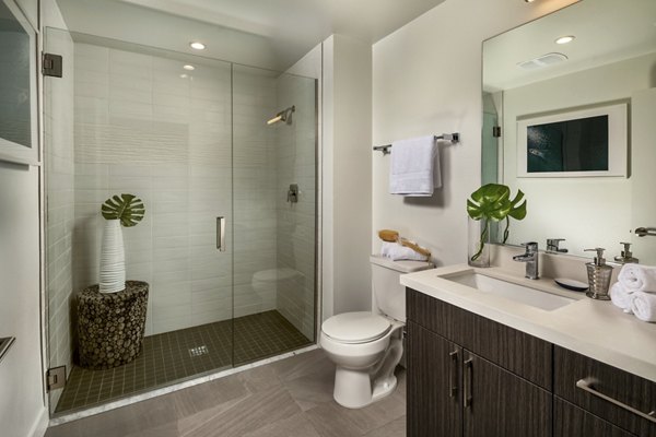 Modern bathroom with sleek fixtures at LA Plaza Village Apartments, featuring luxury design elements for a contemporary living experience