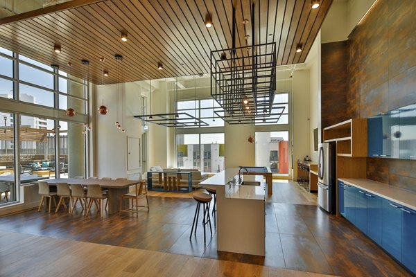 Stylish clubhouse with modern furnishings at LA Plaza Village Apartments, Los Angeles