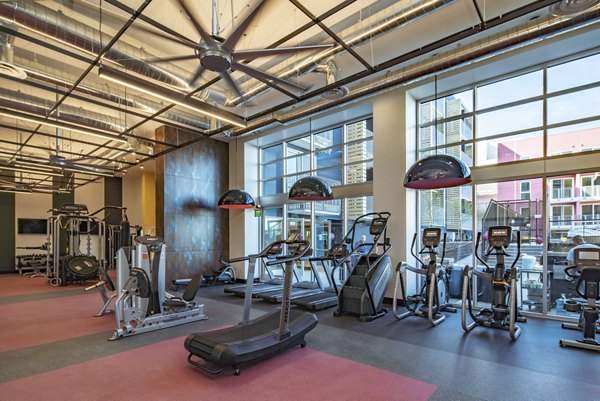 fitness center at LA Plaza Village Apartments