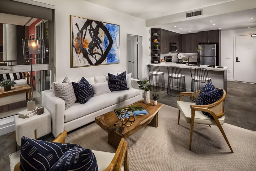 Spacious living room with modern decor at LA Plaza Village Apartments