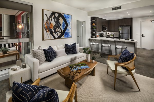 Spacious living room with modern decor at LA Plaza Village Apartments