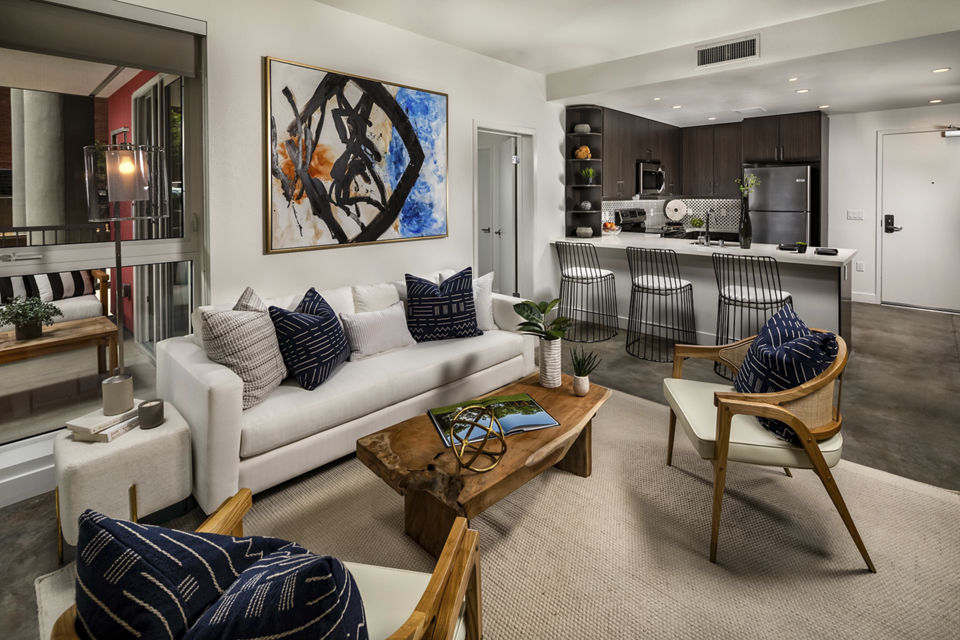 Spacious living room with modern decor at LA Plaza Village Apartments