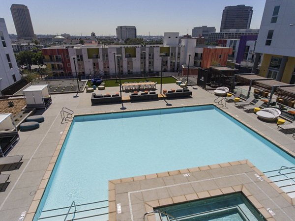 Rooftop pool with city views at LA Plaza Village Apartments