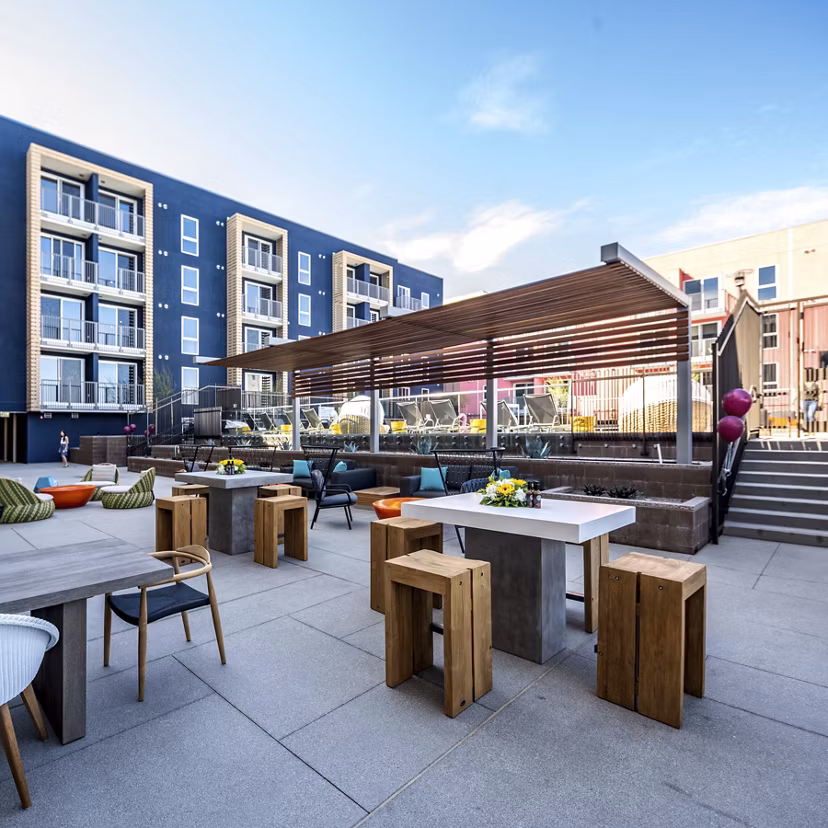 Scenic rooftop deck at LA Plaza Village Apartments with urban skyline views