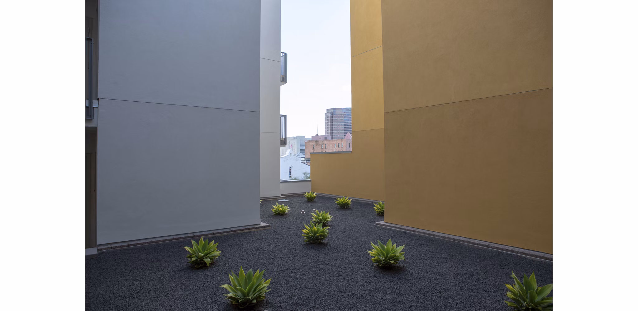 Recreational area with modern seating and greenery at LA Plaza Village Apartments, a luxury community in Los Angeles