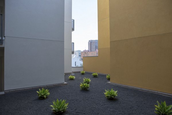 Recreational area with modern seating and greenery at LA Plaza Village Apartments, a luxury community in Los Angeles