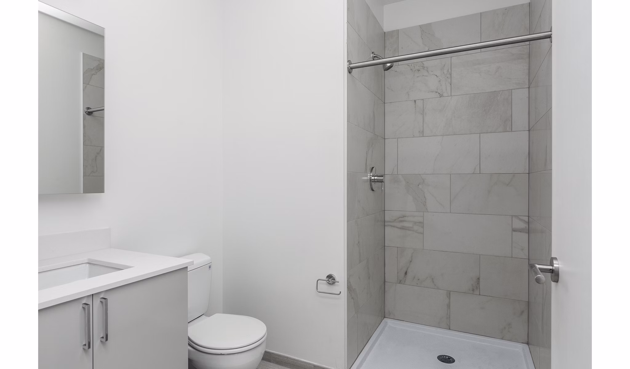Modern bathroom with sleek fixtures and tile flooring at Union House Apartments