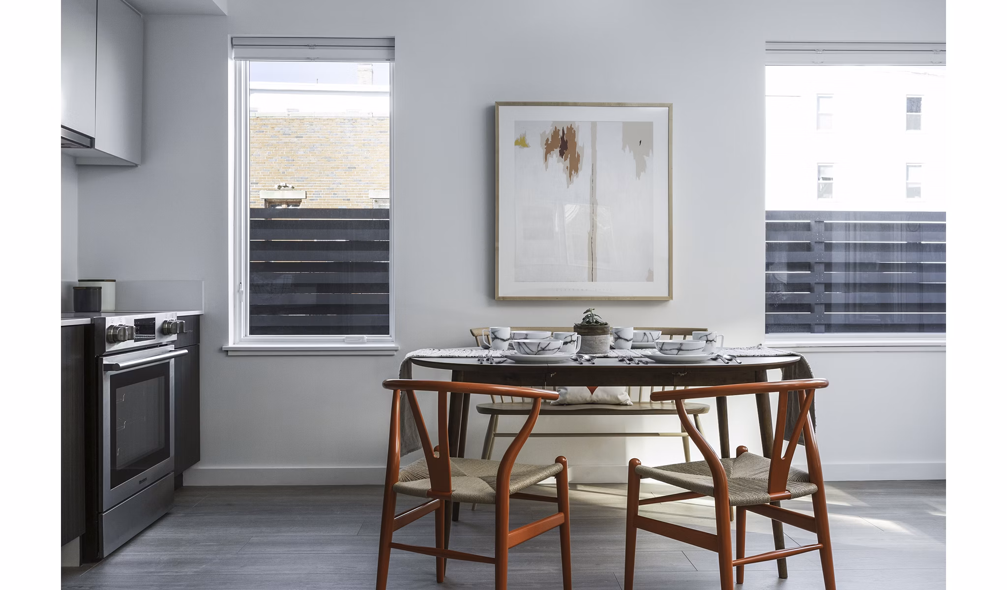 Dining room with modern furniture and stylish lighting at Union House Apartments