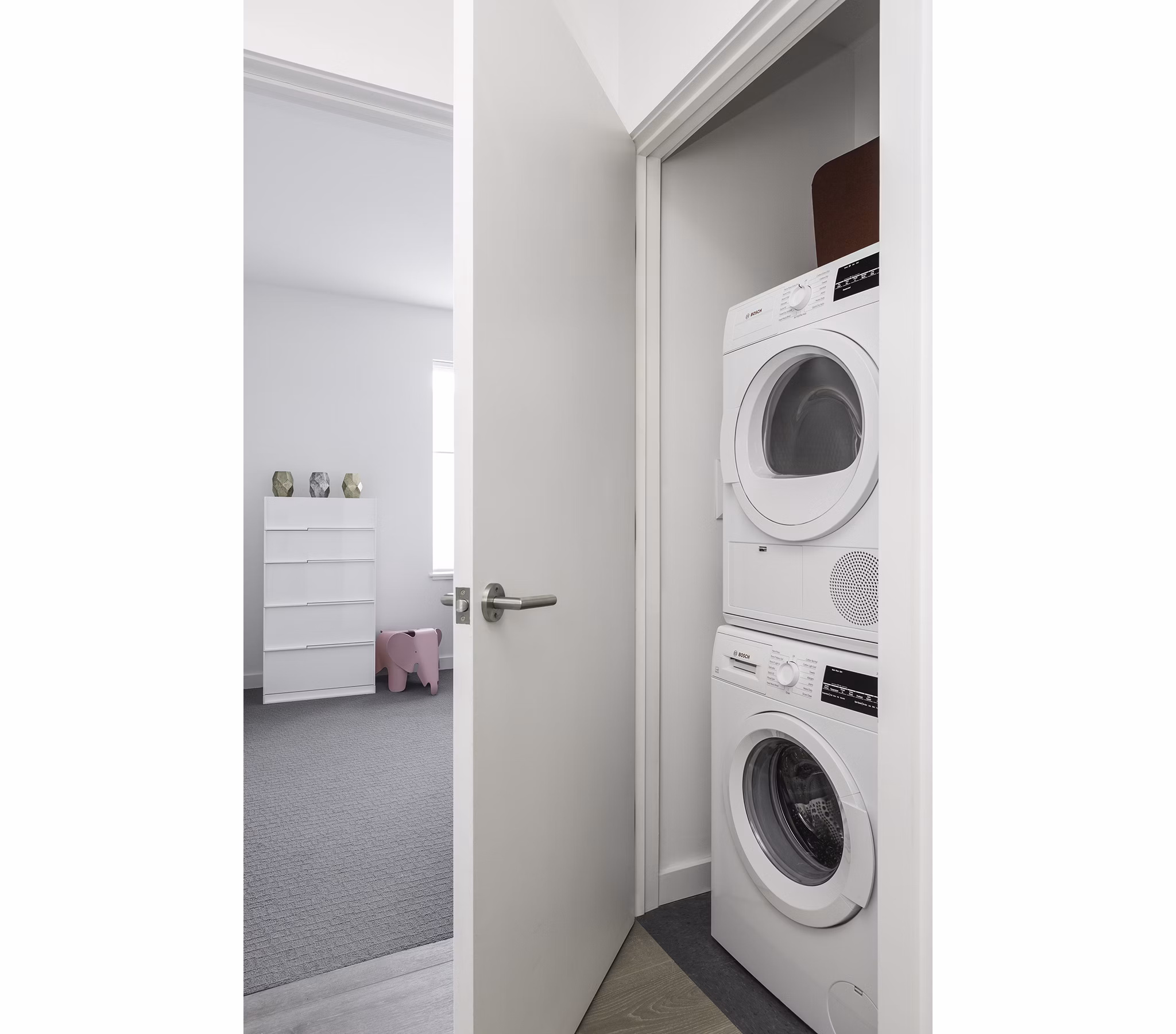 Laundry room with modern washers and dryers in Union House Apartments, a luxury complex designed for convenient city living