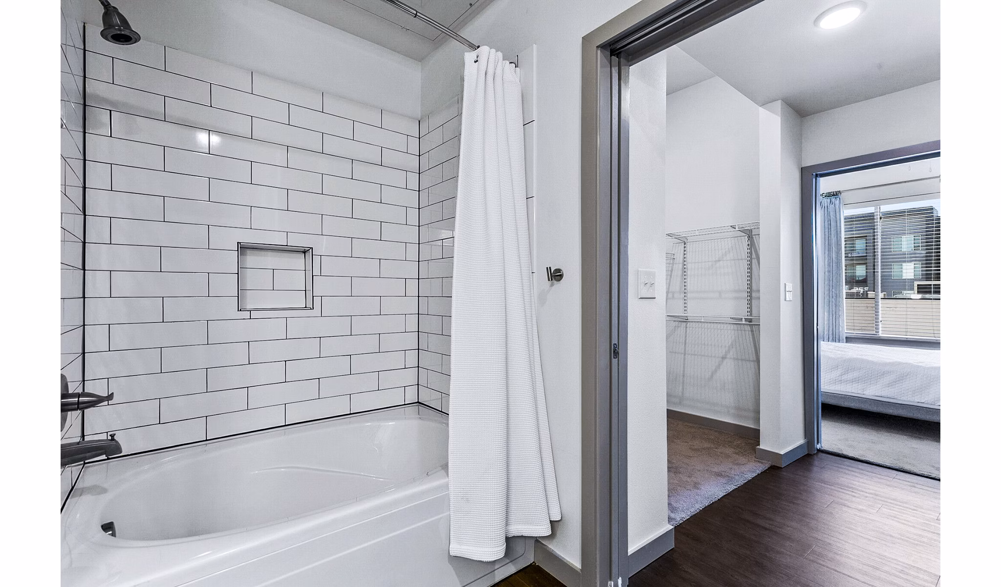 Luxurious bathroom with marble countertops and modern fixtures in West Village Apartments