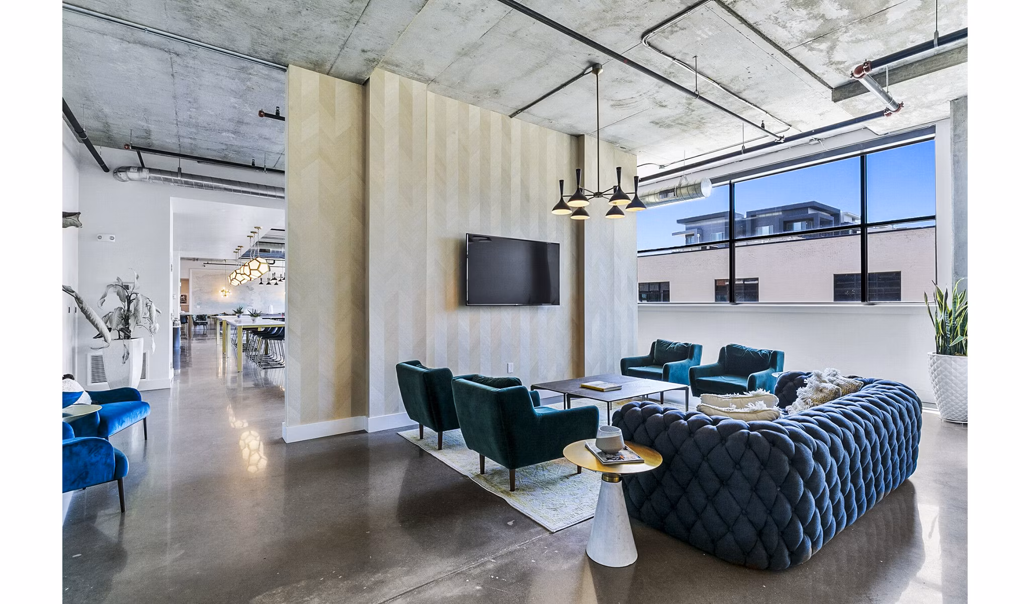 Clubhouse featuring modern lobby design in West Village Apartments, offering luxury living spaces in a vibrant community