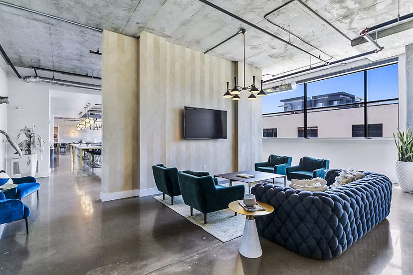 Clubhouse featuring modern lobby design in West Village Apartments, offering luxury living spaces in a vibrant community
