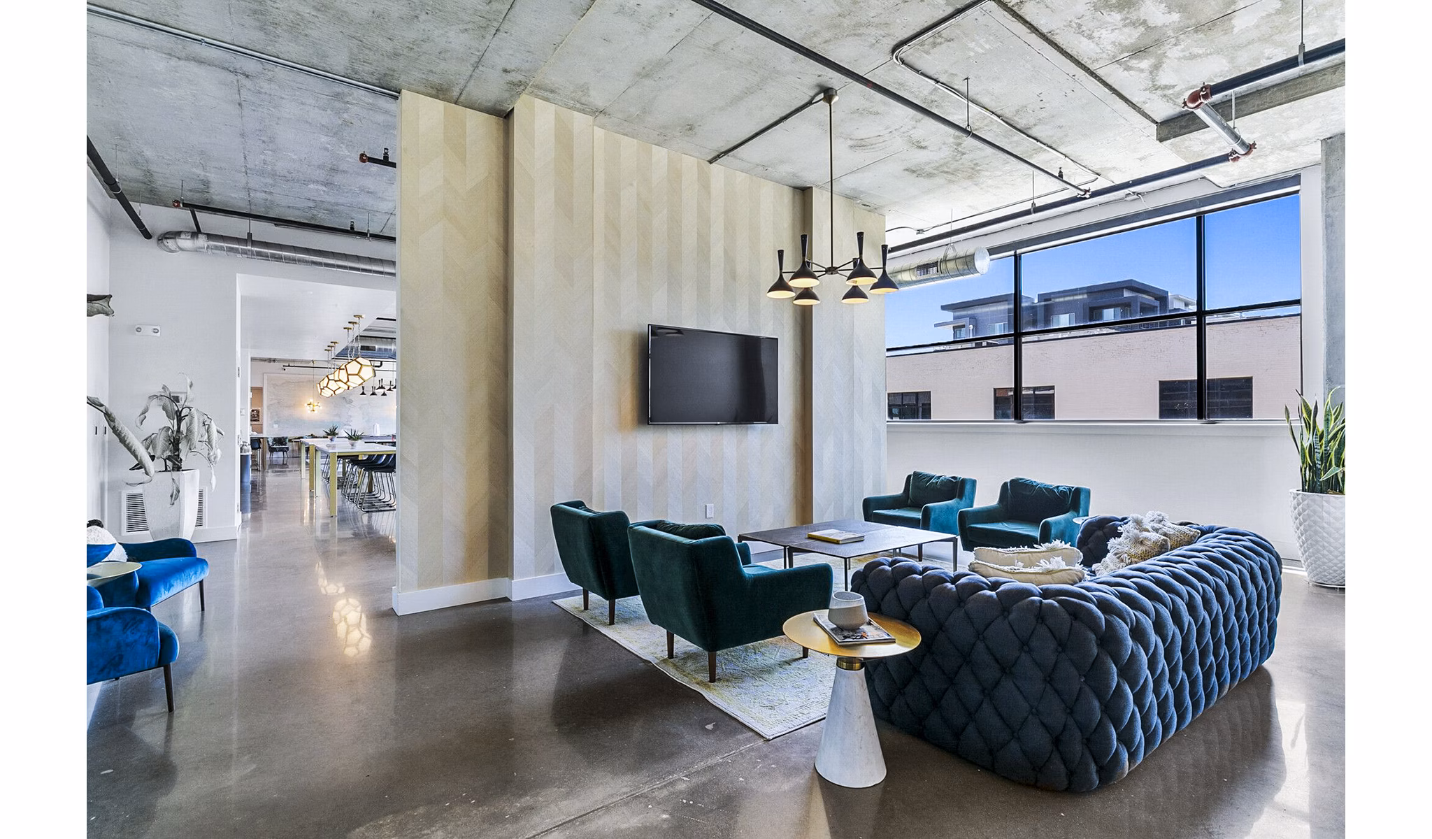 Clubhouse featuring modern lobby design in West Village Apartments, offering luxury living spaces in a vibrant community