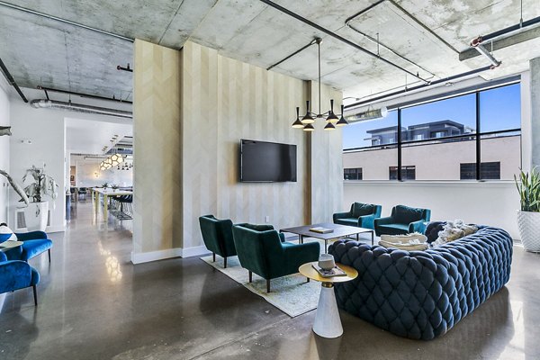 Clubhouse featuring modern lobby design in West Village Apartments, offering luxury living spaces in a vibrant community