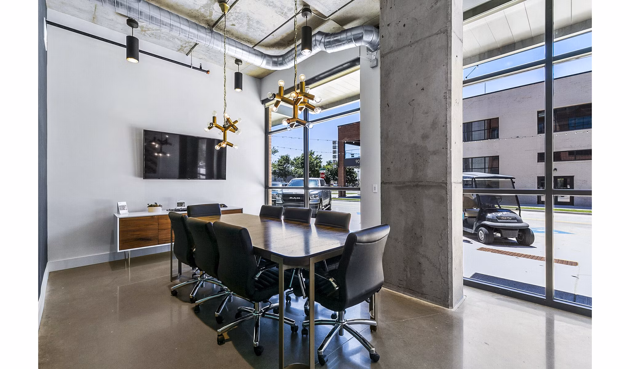 Elegant meeting room with plush seating and modern design at West Village Apartments, perfect for hosting events and gatherings