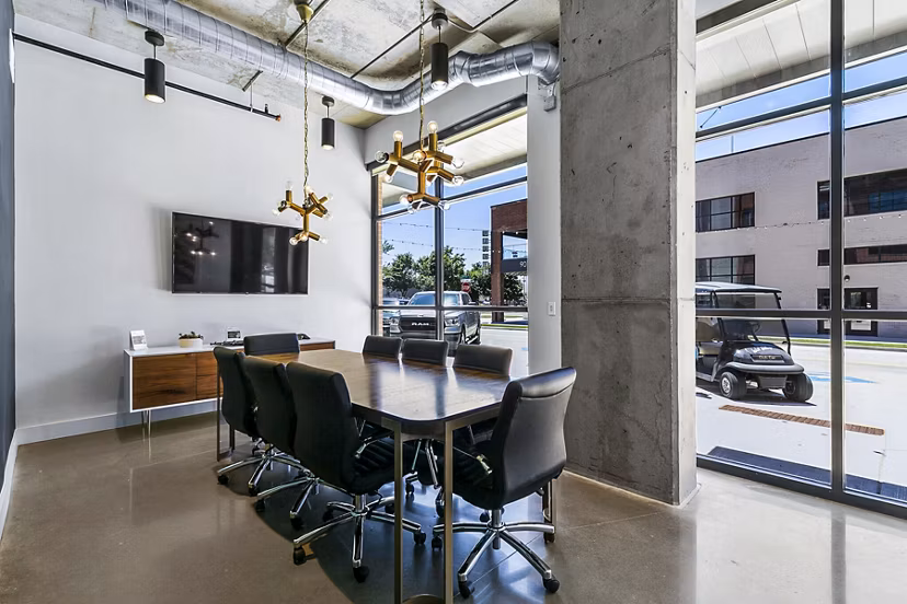Elegant meeting room with plush seating and modern design at West Village Apartments, perfect for hosting events and gatherings