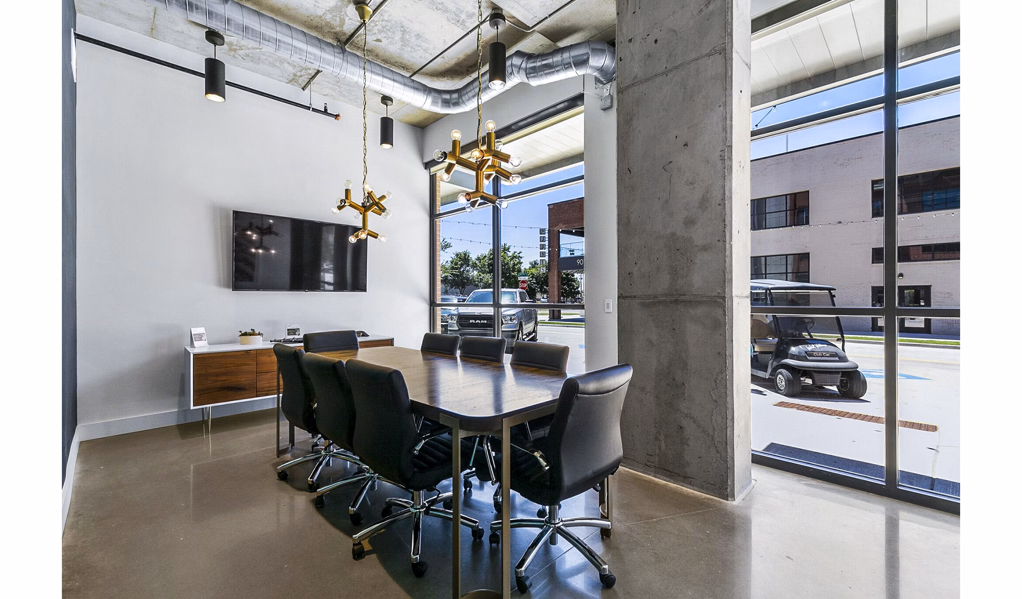 Elegant meeting room with plush seating and modern design at West Village Apartments, perfect for hosting events and gatherings