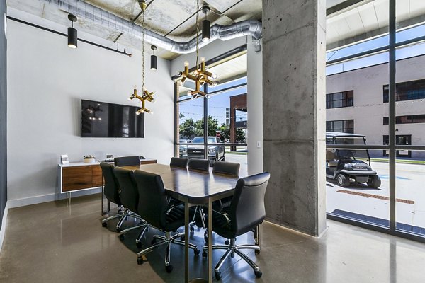 Elegant meeting room with plush seating and modern design at West Village Apartments, perfect for hosting events and gatherings