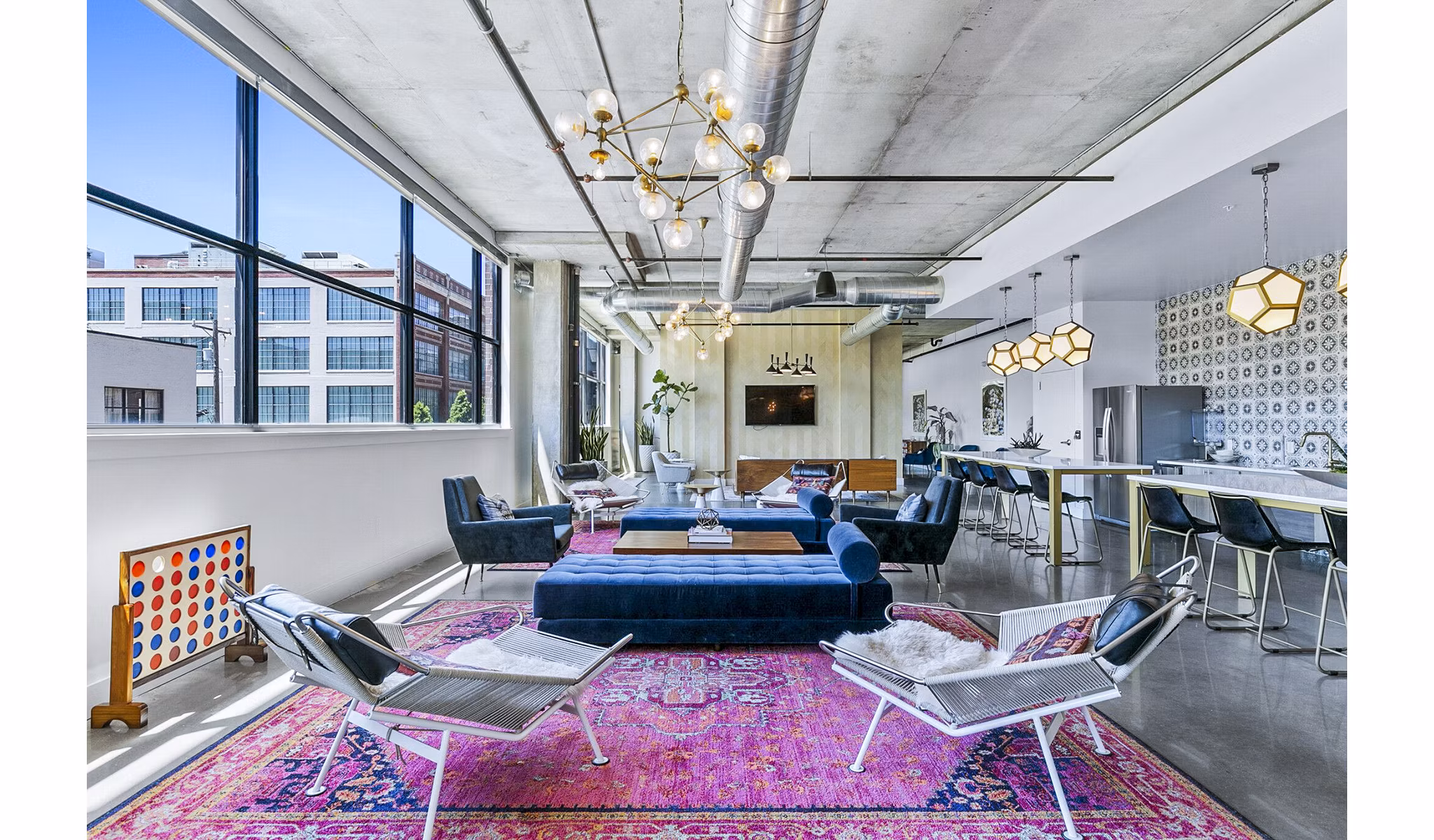 Elegant clubhouse lobby featuring modern decor and seating at West Village Apartments