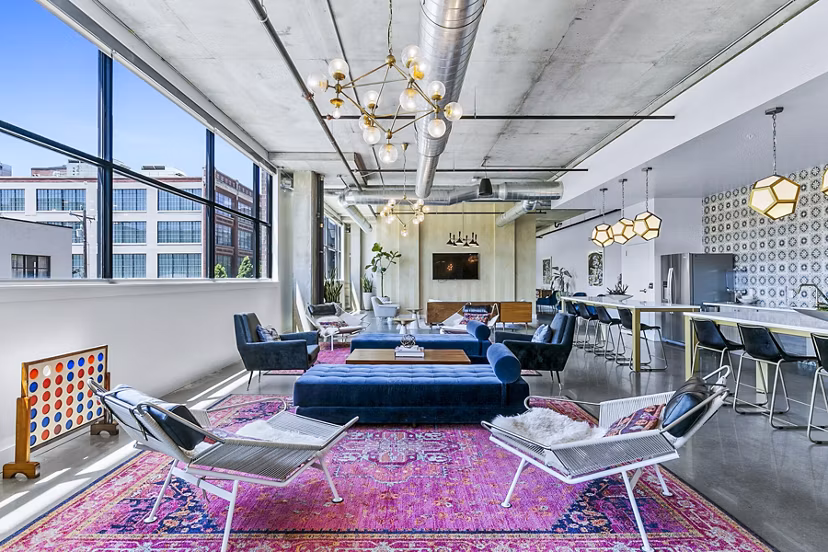 Elegant clubhouse lobby featuring modern decor and seating at West Village Apartments