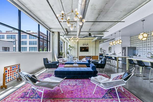 Elegant clubhouse lobby featuring modern decor and seating at West Village Apartments