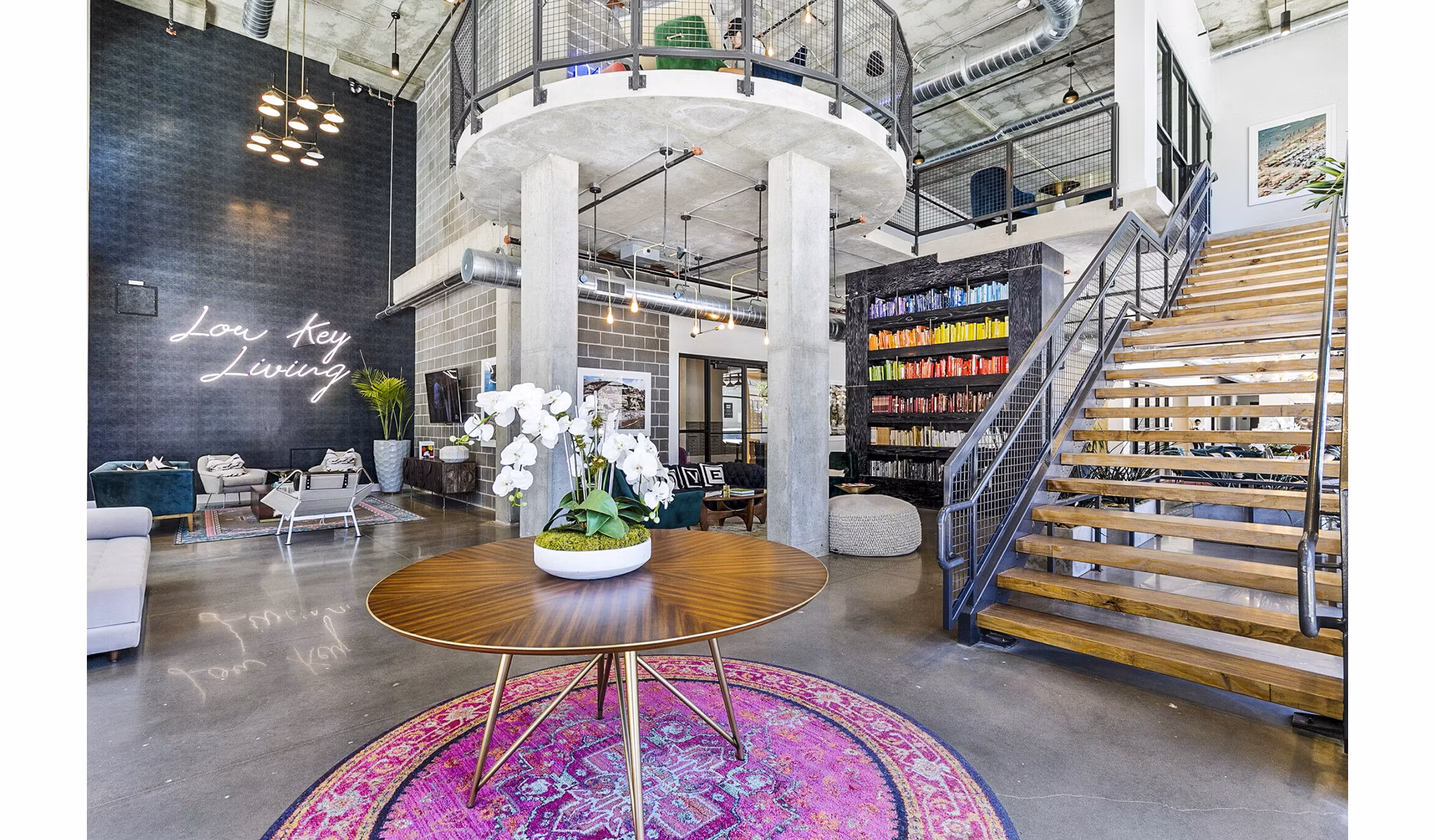 West Village Apartments: Modern clubhouse lobby with contemporary seating and elegant lighting elements in a luxury setting