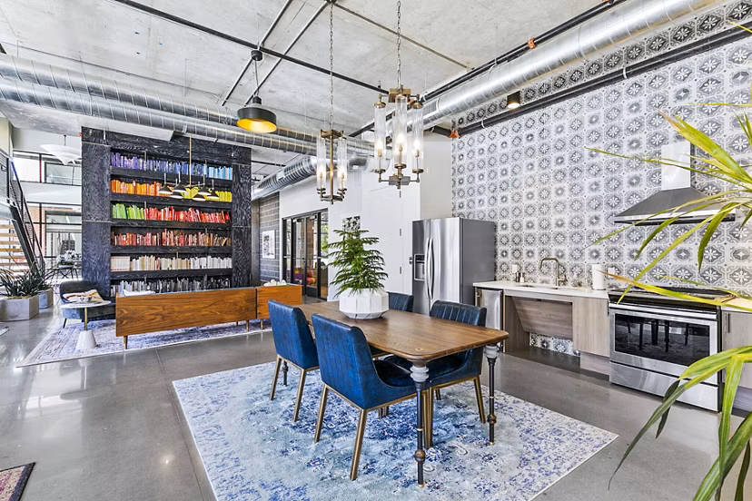 Clubhouse lounge with modern seating in West Village Apartments, Greystar luxury community