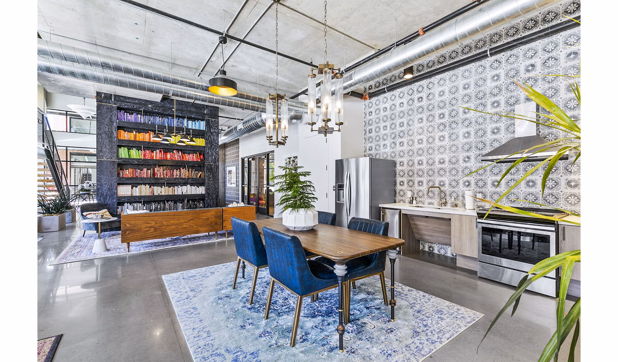 Clubhouse lounge with modern seating in West Village Apartments, Greystar luxury community