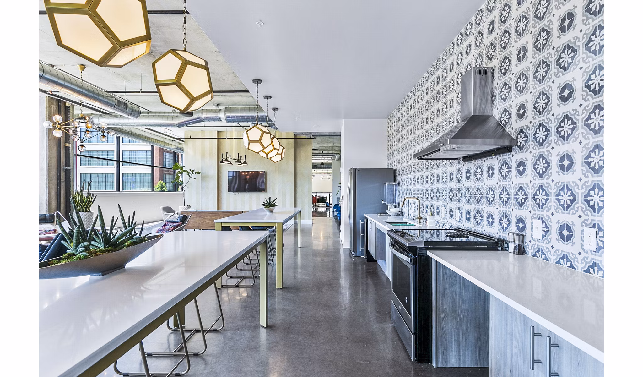 Clubhouse kitchen featuring modern appliances at West Village Apartments, perfect for community gatherings and social events