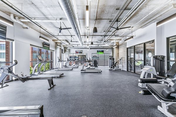 Modern fitness center with state-of-the-art equipment at West Village Apartments