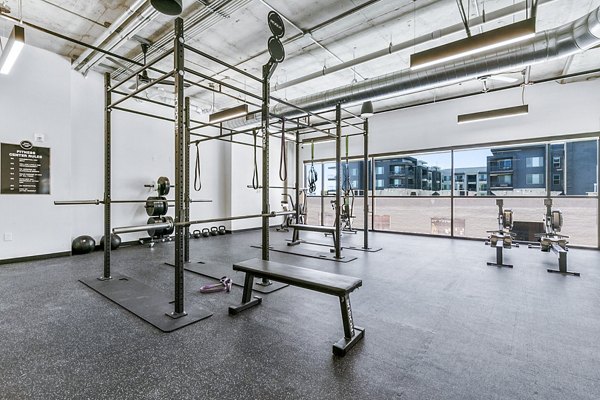 Modern fitness center with state-of-the-art equipment at West Village Apartments
