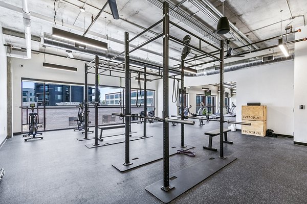 Fitness center with modern equipment at West Village Apartments