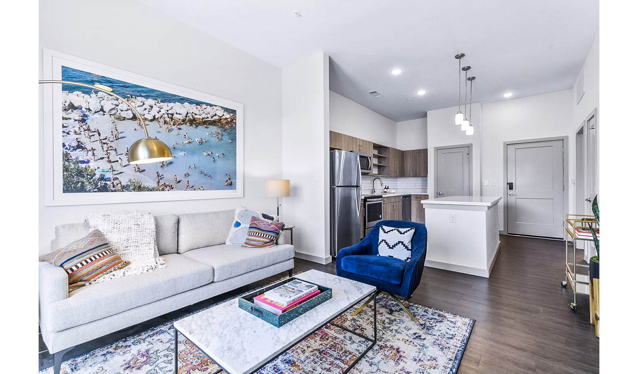 Spacious living room featuring modern decor and cozy seating at West Village Apartments