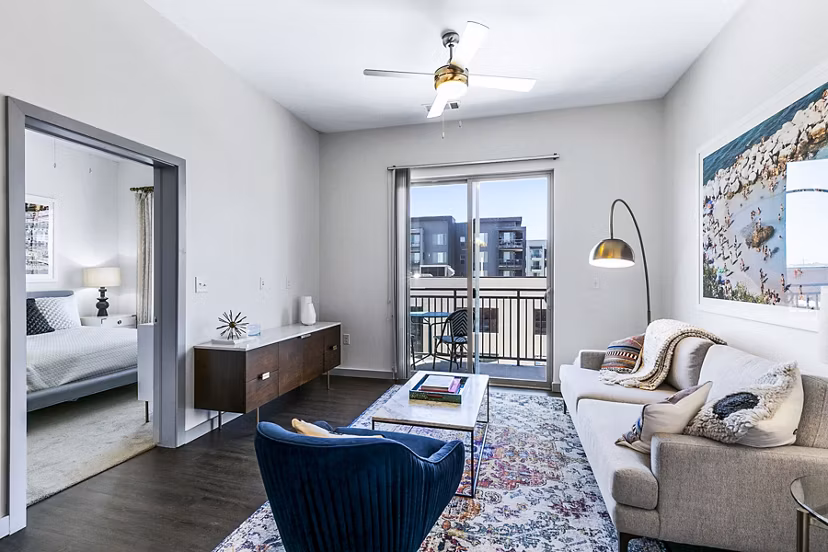 Spacious living room with modern decor in West Village Apartments, luxury residences by Greystar